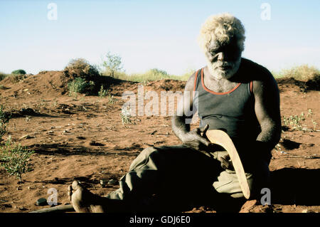 geography / travel, Australia, people, Aborigine is checking his self-made boomerang, Tanami Desert, 1986, Stock Photo