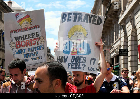 Remain supporters hold anti Brexit Boris Johnson placards posters at the 'March for Europe'  demonstration in London 23 June 2016  KATHY DEWITT Stock Photo