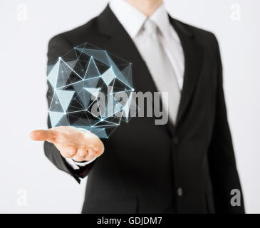 man with virtual low poly projection on hand Stock Photo