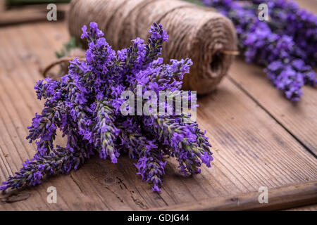 Fresh lavender flowers on vintage wooden background Stock Photo