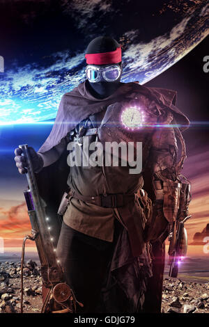 Futuristic soldier posing with gun and armor Stock Photo