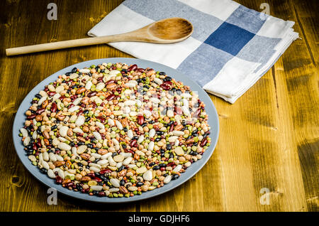 legumes in a dish on wood, close up, background Stock Photo