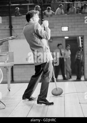 Elvis Presley during a performance at the University of Dayton Fieldhouse, May 27, 1956. Stock Photo