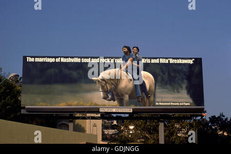Sunset Strip with Kris Kristofferson and Rita Coolidge on billboard circa 1974 Stock Photo