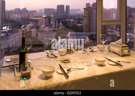 Dinner table with a view of Guangzhou, China Stock Photo