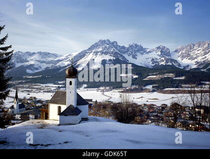 geography / travel, Austria, Tyrol, Ellmau, churches, St. Mary chapel, built 1719 by postmaster Johann Kaisermann, view at Wilder Kaiser (mount), in winter, Stock Photo