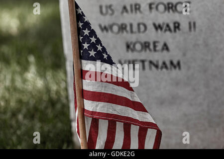 United States Flag on a soldier's gravesite at Arlington National Cemetery on Memorial Day Stock Photo