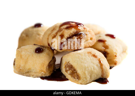 Butter cookies with jam and topping isolated over white background Stock Photo