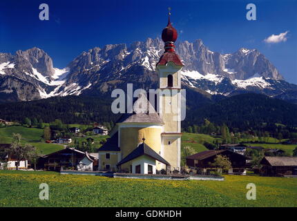 geography / travel, Austria, Tyrol, Going, view towards the municipality with church and Wilder Kaiser (peak), Stock Photo