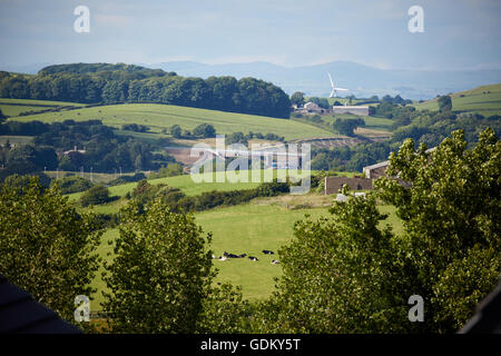 Lancashire, lancashire UK landscape with M6 motorway cutting through the landscape Countryside fields farmland grazing long gras Stock Photo