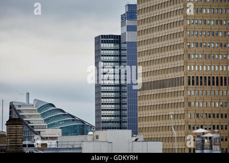 Cooperative HQ office buildings Noma  framed by the yellow tiles of Manchester Arndale office tower and CIS tower 1 Angel Square Stock Photo