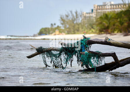 Baskets with fishing nets on small pier, Santa Giulia beach