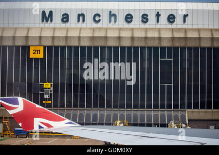 Ring way Manchester Airport T2 terminal from Virgin Atlantic 474 wingtip and Union Jack flag Stock Photo