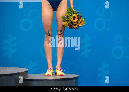 Hamburg, Germany. 16th July, 2016. Gwen Jorgensen (USA) holds a bouquet during the victory ceremony at the World Triathlon Series - 7th Stop in Hamburg, Germany, 16 July 2016. Photo: LUKAS SCHULZE/dpa/Alamy Live News Stock Photo