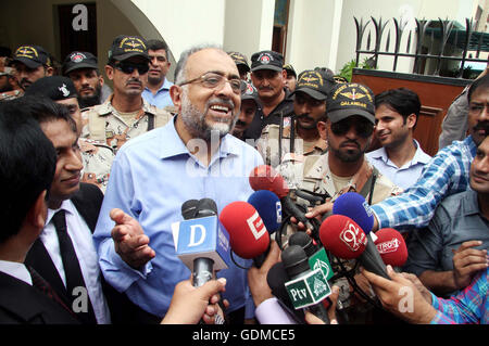 Sindh High Court Chief Justice Sajjad Ali Shah along with his son Advocate Awais Ali Shah, who returned after 29 days recovered by security forces from custody of terrorists during an operation near Tank, addresses to media persons during press conference at his residency in Karachi on Tuesday, July 19, 2016. Stock Photo