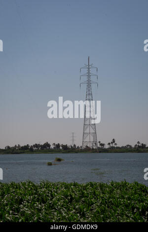 (160719) -- BENI SUEF, July 19, 2016 (Xinhua) -- Some 175-meter-high power grid towers are seen on the bank of Nile River at Beni Suef Governorate, Egypt, June 30, 2016. Along the Nile River, the Egypt EETC 500kV Transmission Lines Project (EETC Project), a cooperative one between China Electric Power Equipment and Technology Co. Ltd (CET) and Egypt is under construction. The over-650-million-dollar EETC Project, which covers almost the whole area of the Nile River delta, is the largest transmission lines project in Egypt's history. (Xinhua/Meng Tao) Stock Photo