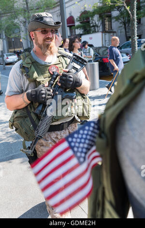 Cleveland, Ohio, USA. 19th July, 2016. Members of an Ohio militia group protest by openly carrying military style semi-automatic weapons downtown near the Republican National Convention July 19, 2016 in Cleveland, Ohio. Credit:  Planetpix/Alamy Live News Stock Photo