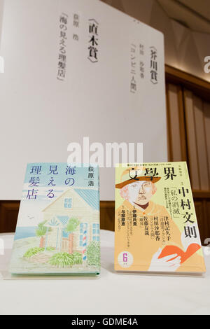 Awarded novels are seen before the 155th Naoki Prize and Akutagawa Prize press conference at the Imperial Hotel on July 19, 2016 in Tokyo, Japan. Hiroshi Ogiwara's Umi No Mieru Rihatsuten won the Naoki Prize which is given to for a work of popular fiction, while Sayaka Murata's Konbini Ningen won the Akutagawa Prize, which is awarded to the best serious literary story. Both prizes were established in 1935 and are awarded twice a year. © Rodrigo Reyes Marin/AFLO/Alamy Live News Stock Photo