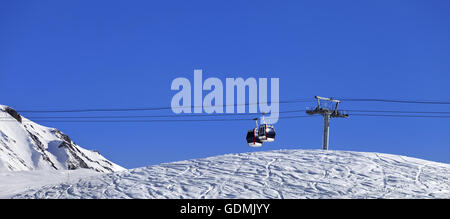 Panoramic view on gondola lift and ski slope. Georgia, region Gudauri. Caucasus Mountains. Stock Photo