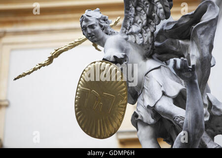 Statue of Saint Michael with gold shield and sword in center of Vienna ...