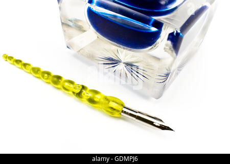 Old pen and crystal inkwell isolated on white Stock Photo