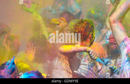 People celebrating during the color throw at the Holi Festival of Colors in Barcelona, Spain. Stock Photo