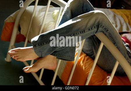 Girl relaxing in her bedroom Stock Photo