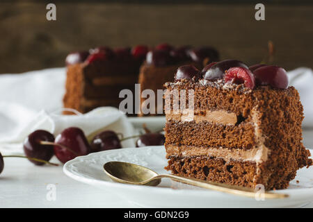 Piece of chocolate cake with berries selective focus Stock Photo