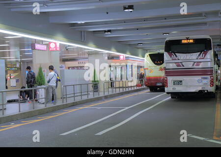 People wait for bus at Hankyu Bus Terminal in Osaka Japan. Stock Photo