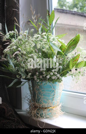 beautiful bouquet from wild field flowers in pastel pearl gray colors for birthday and weddings Stock Photo