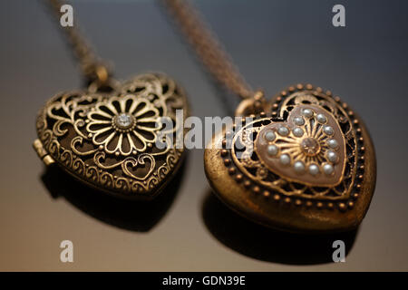 Heart-shaped necklace on black background Stock Photo