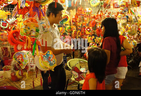 Crowded of people on Luong Nhu Hoc lantern street at night Stock Photo