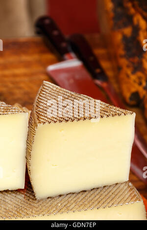 Manchego cheese portion on isolated white background Stock Photo - Alamy