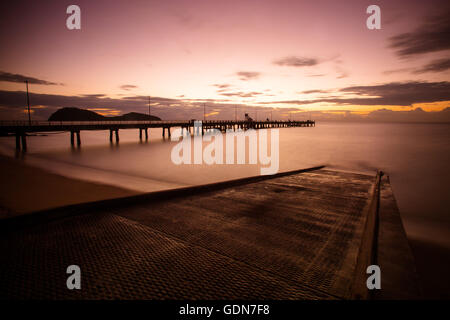 The iconic Palm Cove jetty and boat ramp at sunrise on a winter's morning in Queensland, Australia Stock Photo