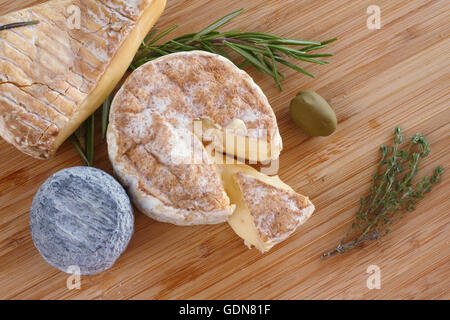 French Cheese composition on wooden board close-up Stock Photo
