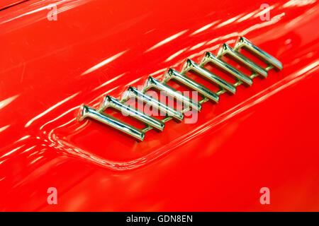 Details chrome decoration on a red car Stock Photo
