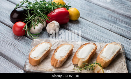 Slices of baguette with butter. Stock Photo