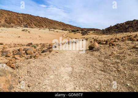 Footpath leading through volcanic landscape of Tenerife island, Spain Stock Photo