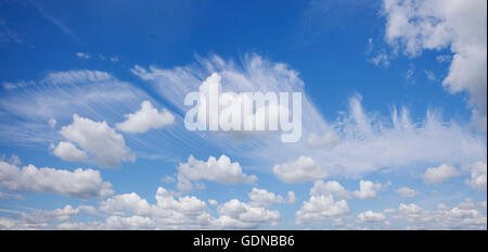 Wispy feathery cirrus clouds covering a blue sky. UK Stock Photo