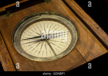 Closeup compass for ships on wooden box, Spain Stock Photo