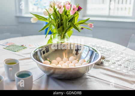 Bowl of hard boiled eggs prepared for food colour dye at Easter Stock Photo