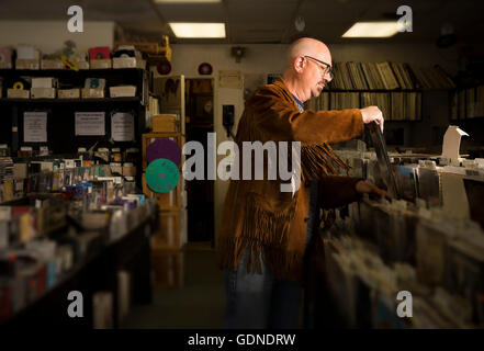 Mature man in record shop, filing records Stock Photo