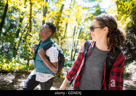 Young female and male hikers hiking in forest, Arcadia, California, USA Stock Photo