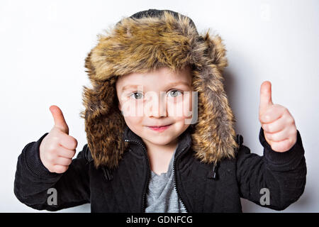 child in fur Hat fashion casual winter style little boy Stock Photo