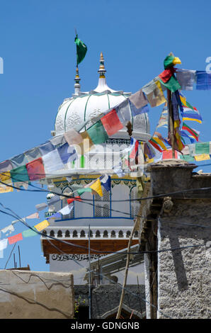 Buddhist Prayer flags in front of Islamic Jama Masjid Mosque, Leh, Ladakh,  Jammu and Kashmir, India Stock Photo