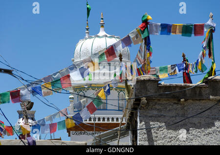 Buddhist Prayer flags in front of Islamic Jama Masjid Mosque, Leh, Ladakh,  Jammu and Kashmir, India Stock Photo