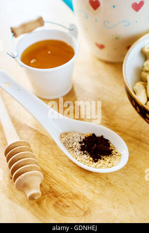 Close up view on healthy cereals with honey and nuts, for breakfast Stock Photo