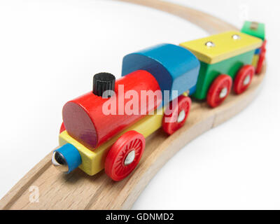 Colorful wooden toy train detail isolated on white. Horizontal Stock Photo