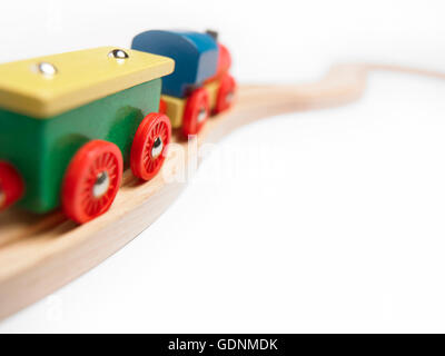 Colorful wooden toy train detail isolated on white. Horizontal Stock Photo