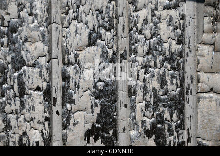 Charred wooden wall after af ire. Stock Photo
